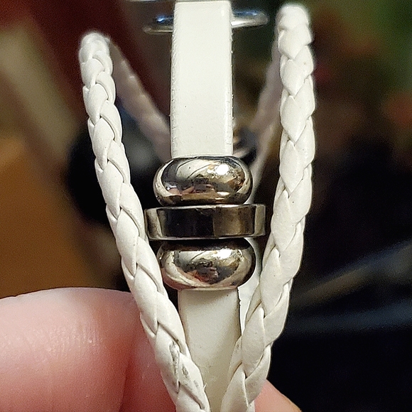 Choice of black or white faux leather snap bracelets. - Picture 8 of 9